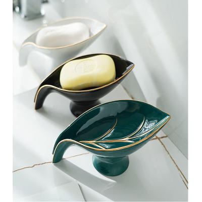 China Traditional Ceramic Leaf Shape Decorative Self Draining Soap Dish Holder Vertical Shower Bathroom Kitchen Drain Soap Box for sale