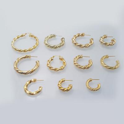 China TRENDY Gold Twisted Circle Earrings Shape Ladies Wave Curve Earrings Copper Brass Twist Circle Earrings for sale