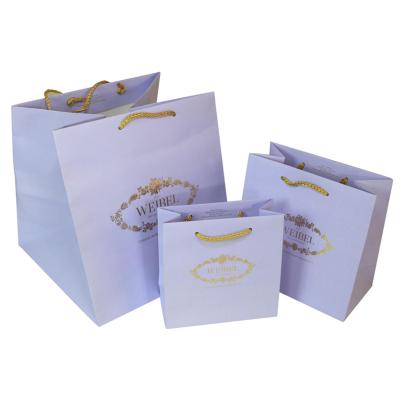 China Luxury Oil Printing Purple / White Kraft Paper Bags For Clothes With Flat Bottom for sale