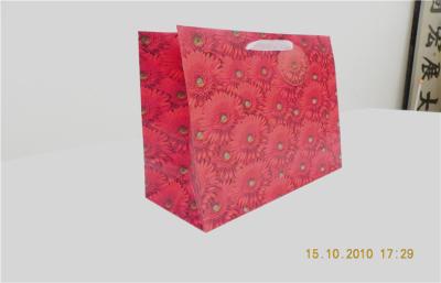 China Fancy 157gsm Art Red Custom Printed Paper Gift Bags With Die Cut Handle for sale