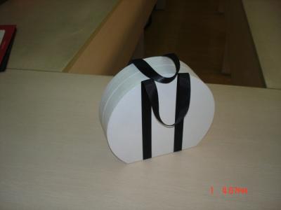 China Embossing Recycled Circle Gift Cardboard Boxes With Ribbon Handle for sale