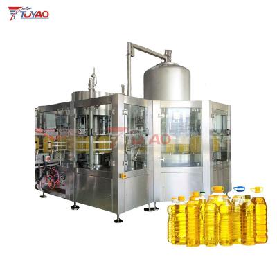 China Food TUYAO cooking oil manufacturing machine engine oil filling machine rotary weighing olive oil filling machine for sale