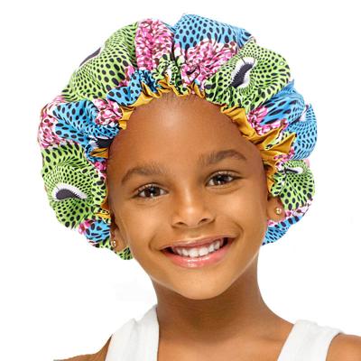 China Double Layer Satin Cowl Kids Sleep Head Hair Wrap Kids Stain Cowl Double Layer Silky Elastic Printed Turban Hat With Elastic Adjusting Buckle for sale