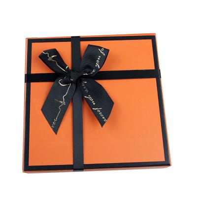 China Recyclable Customized Birthday Orange Rigid Paper Gift Box Holiday Gifts Bowknot Cosmetic Packaging Box for sale