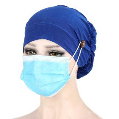 China 2020 Wholesale Character Hot Sale Solid Color Chemo Hats Fashion Simple Elastic Women Muslim Hijab Hat With Button for sale