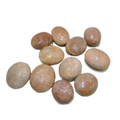 China Natural Shiny Orange Stone Crystal Palm Tumbled Crystal Stone from China Moonstone Palm for Healing for sale