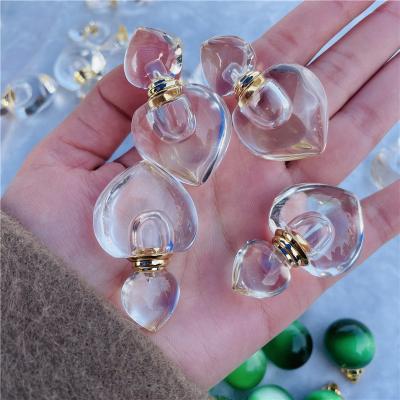 China China Crystal Perfume Bottle Pendant High Quality White Clear Hand Carving Quartz Oi Perfume Heart Shape Necklace Pendant for sale