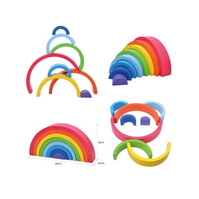 China Building Toy Montessori 12 Piece Colorful Semicircle Wooden Stacking Blocks Toys Rainbow Stacker With Fold for sale