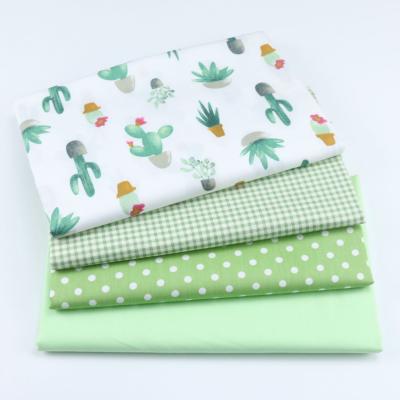 China Organic Green Cartoon Cactus Fabric Grid Dot Solid Color Fabric Wholesale Baby Bedding Fabric for sale