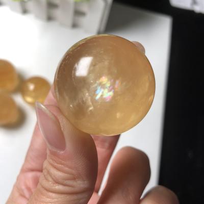 China Wholesale Natural Bulk China Rainbow Honey Calcite Sphere Polished Calcite Crystal Yellow Ball Folk Crafts For Souvenir for sale