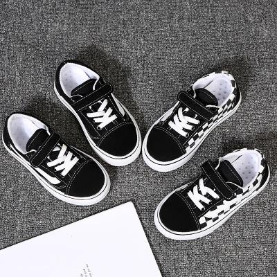 China Flat Students Pure Color And Plaid Print Unisex Boys Shoes Casual Fashionable Canvas Kids Shoes for sale