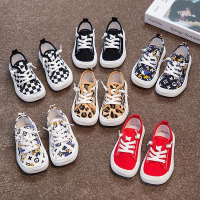 China Fashion trend unisex strap lace up leopard print upper kids white canvas shoes wholesale leopard baby shoes for sale