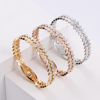 China FASHIONABLE Indian designer bangle wave dijes scam brazalete ORDRM gold plated stainless steel bangle for sale