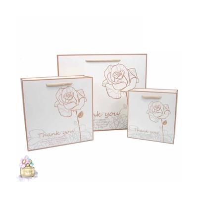 China New Recyclable Rose Gift Cute Paper Bag Gift Bag Party Accessories Wholesale Printed Shopping Paper Bag for sale