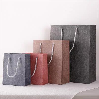 China Recyclable Custom Wholesale Luxury Paper Bag Kraft Shopping Paper Bag With Logo For Clothing Packaging for sale