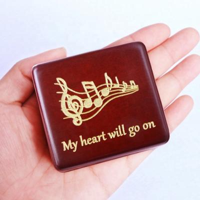 China Red Wooden Game Melody Music Creative Marketing Gift Popular Rocker Arm Professional Wholesale Wine Music Box Movie for sale