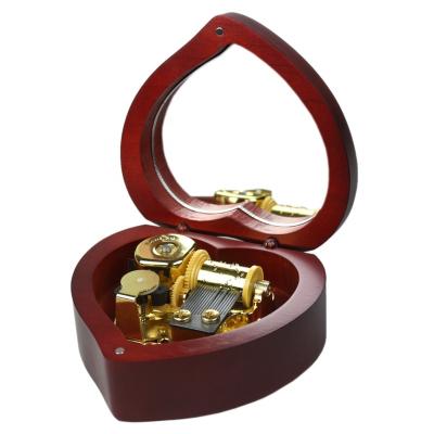 China Delicate and Exquisite Wholesale Wooden Heart Shaped Retro Music Box Custom Engraving Creative Nostalgic Gift with Mirror Red Wine for sale