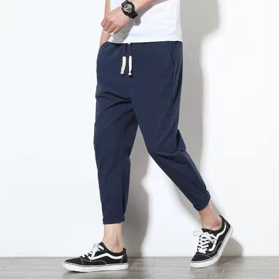 China Anti-wrinkle 2021 new summer nine minutes of pants, pants lovers, men's sports casual cotton and linen pants for sale