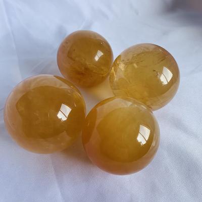 China Europe Wholesale Price Decoration High Quality Natural Crystal Gift Orange Calcite Sphere for sale