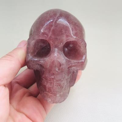 China Europe Wholesale Price Hand Carved Large Size Natural Strawberry Quartz Crystal Skulls for sale