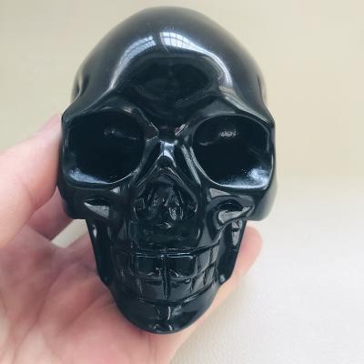 China Europe Wholesale Price Hand Carved Natural Crystal Quartz Black Obsidian Skulls for sale