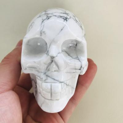 China Europe wholesale hand carved large size natural quartz crystal howlite stone skulls for sale