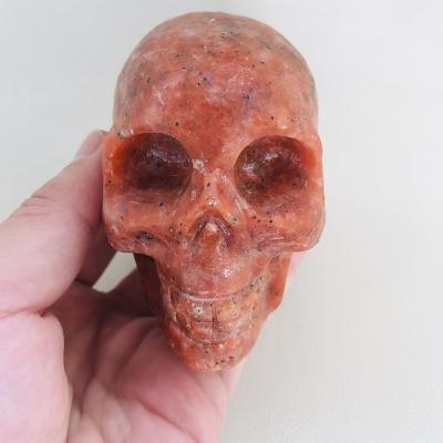 China Europe wholesale price hand carved big size natural crystal stone sunstone skulls for sale