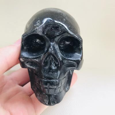 China Europe Wholesale Hand Carved Big Size Natural Crystal Quartz Black Rutilated Quartz Skulls for sale