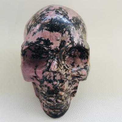 China Wholesale Europe Hand Carved Skulls Large Size Rhodnite Stone Peach Flower Stone Skulls for sale