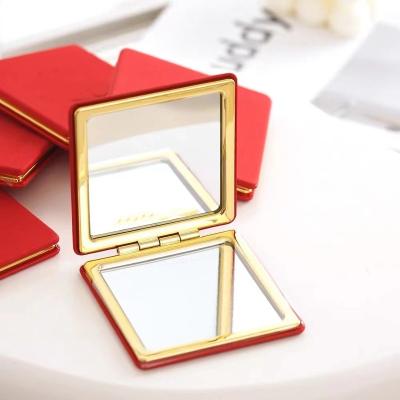 China Logo Beauty Wholesale Small Gold Luxury Hand Held Custom Vanity Enlargement Cosmetic Makeup Mirror Mini Mirror Red Leather for sale