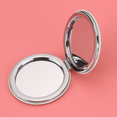 China Small Round Mini Magnifying Pocket Mirrors Small Pocket Wholesale Makeup Mirror Promotional Custom Logo Mirrors for sale