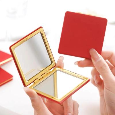 China Hot Selling Gift Small Magnifying Square Shaped Ladies Red Leather Portable Makeup Pocket Compact Mirror for sale