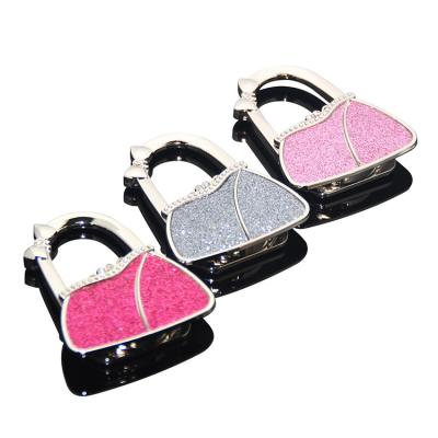 China Various Colors Metal Promotional Gift Lady Women Bag Shape Purse Holder Portable Foldable Hook Bag Glitter Purse Hook Table Pink Hanger for sale