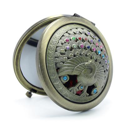 China Lady Gifts Pocket Small Stainless Steel Peacock Lighted Bronze Rhinestone Mirror Hand Held Factory Folding Antique Metal Make Up Mirror for sale