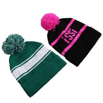 China COMMON Custom Acrylic Jacquard Knit Beanies With Pom Wholesale Winter Hats With Logo for sale