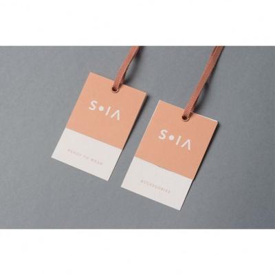 China Viable Custom Garment Printed Instruction Hang Tag Swing Tag Designs Card Clothing Paper Wash Tag With Ribbon for sale