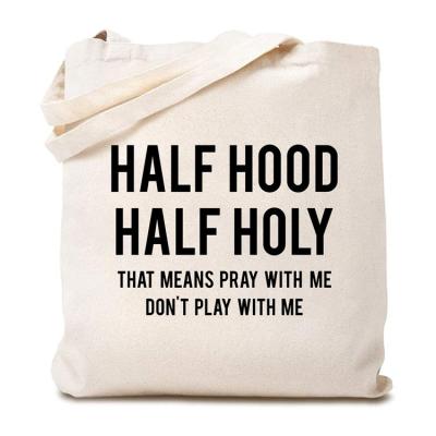 China Wholesale Reusable Half Hood Half Holy That Means Pray With Me Cotton Canvas Tote Bag For Women Funny Reusable Shopping Shoulder Bag for sale