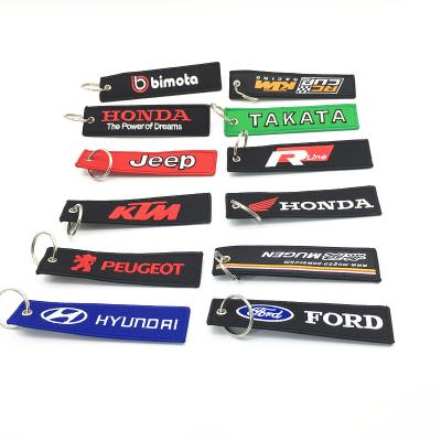 China Custom Fabric Woven Remove Front Theft Key Indicator Key Chain Car Motorcycle Embroidered Embroidered Key Chain for sale