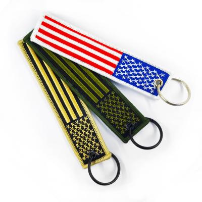 China Custom Aviation Woven Mark Keychain Gift Woven REMOVE BEFORE FLIGHT Commemorative Embroidery Woven Keychains for sale