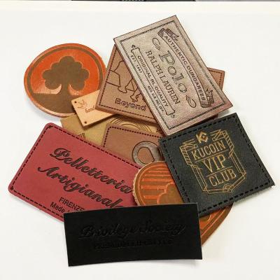 China Viable factory cheap leather label for hat bag garment, customized leather patch low moq for sale