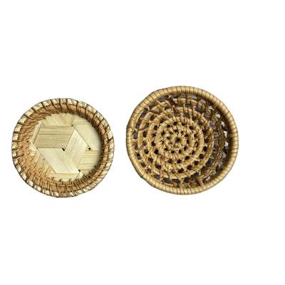 China Handmade Storage Tray Egg Holder Classic Round Mini Plates Vietnam Rattan Food Dish Place Mat Coffee Cup Holder Safe Rattan Coaster for sale