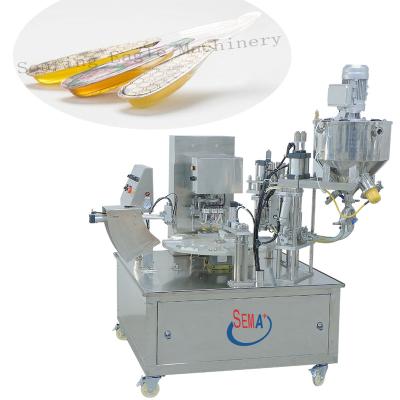 China Automatic Honey Spoon Packaging Machine Food 2 Line Filling And Sealing Machine for sale