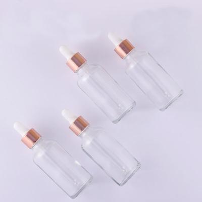 China Personal Skin Care Packaging Cosmetic Essential Oil Wholesale Private Label Packaging Materials 50ml Bottle Clear Rose Gold Ring Serum Dropper Bottle for sale