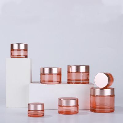 China Personal Skin Care Packaging 5g-100g Wholesale Cosmetic Pink Glass Skin Care Jar Private Label Empty Cream Jar With Rose Gold Cap for sale