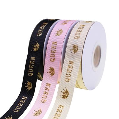 China Wholesale custom logo single face 1 inch black polyester ribbon gold foil grosgrain printed ribbon for sale