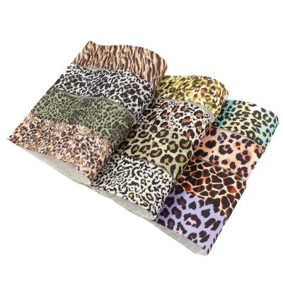 China Single Leopard T.R face 38 mm 100 yard print leopard grosgrain ribbon / roll for gift wrapping for sale