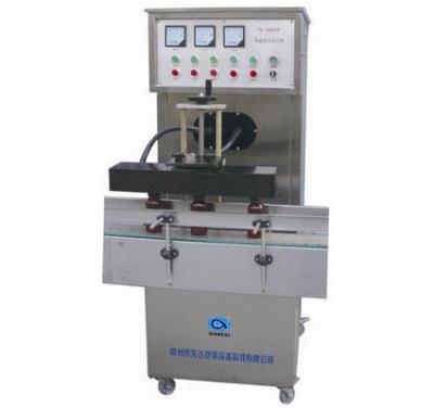 China Efficient Automatic Food Electromagnetic Induction Aluminum Foil Sealing Machine for sale