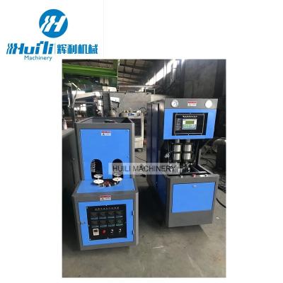 China Plastic Bottle Semi Automatic 2cavity Pet Blowing Machine en venta