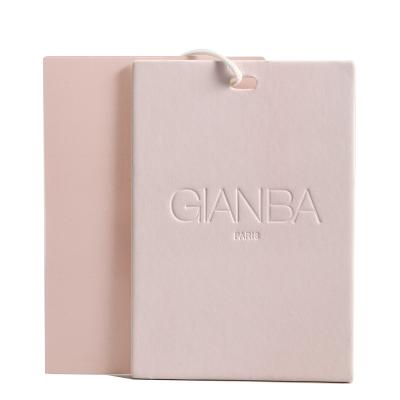 China Custom Made Embossed Pink Paper Shirt Viable Simple High Sense Eco-Friendly Brand Logo Garment Shoes Bags Dangle Hang Tags For Clothing for sale