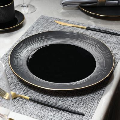 China Sustainable Hotel Desert Restaurant Dish Supplier Gold Plated Black Round Porcelain Plates Nordic Tableware Ceramic Dish for sale